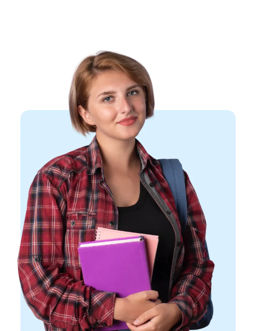 Student holding books after completing the student development program